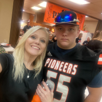  Riley Dunkel with mom at football breakfast